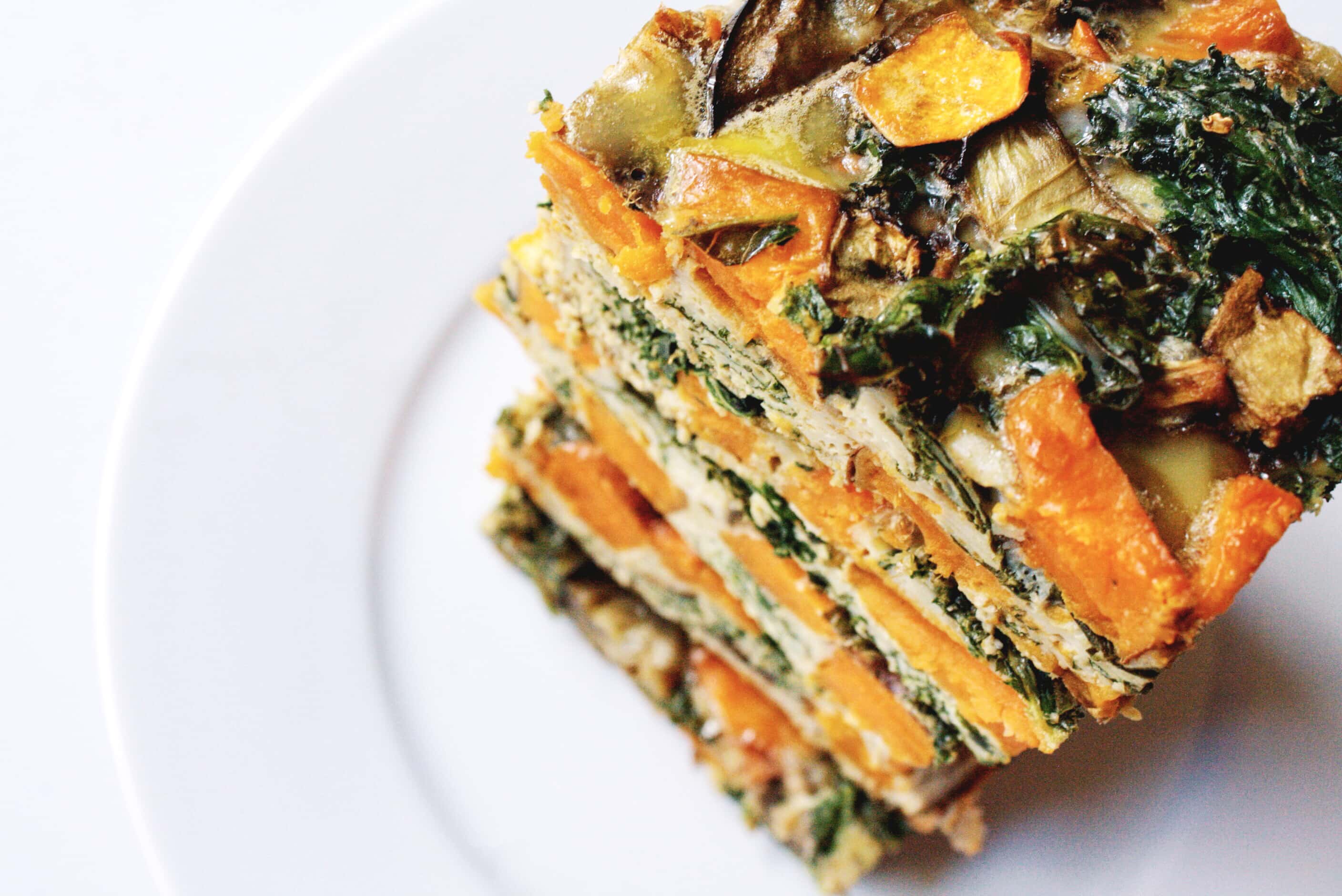 A stack of farmers' market vegetable egg bake on a plate.