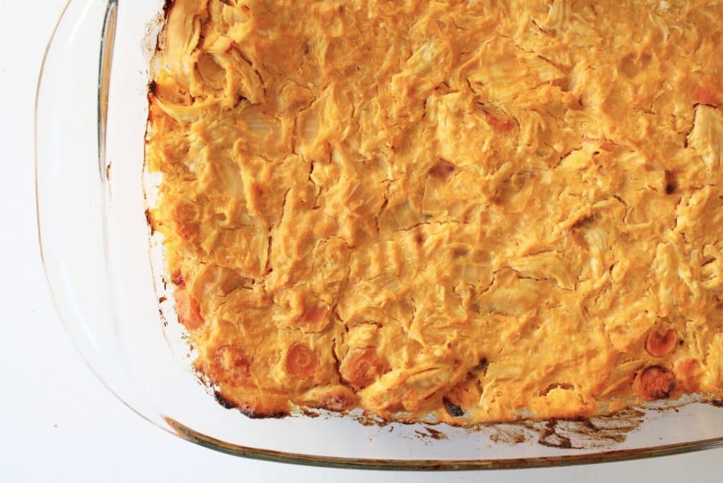 buffalo chicken casserole close on a deep glass baking dish