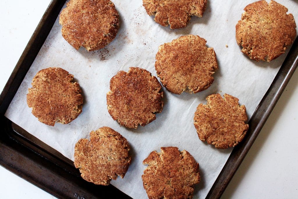 Low-Carb Snickerdoodle Cookies on a baking tray lined with parchment paper