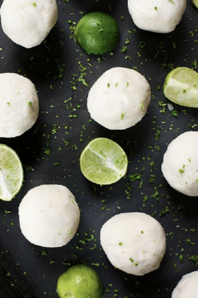 vertical-image-Key-Lime-Pie-Fat-Bombs-with-halved-lime-wedges