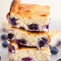 3 easy keto blueberry cheesecake bars stacked on top of each other
