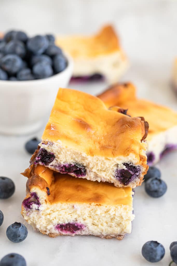 updated hero shot of 2 low-carb blueberry cheesecake bars recipe