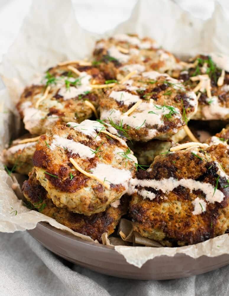 delicious cheesy chicken fritters in a bowl close up