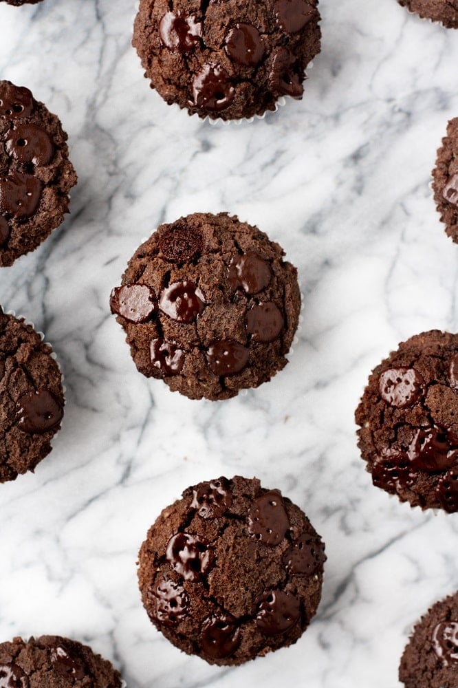 overhead-close-up-shot-on-marble-baking-board-of-Low-Carb-Triple-Chocolate-Zucchini-Muffins