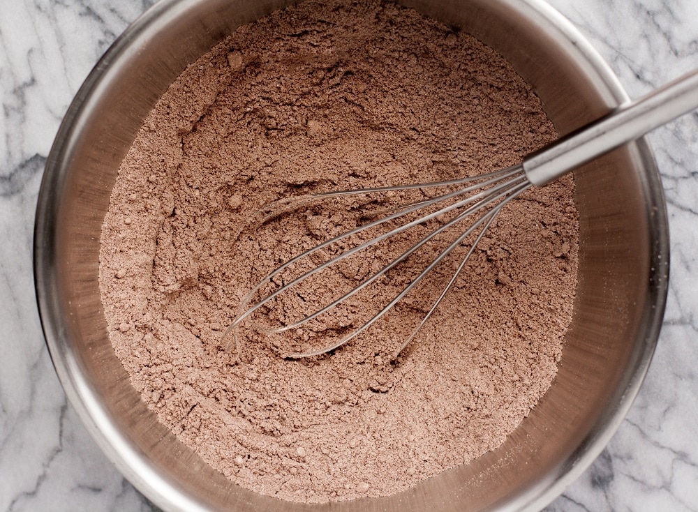 dry-ingredients-whisked-in-bowl-for-Low-Carb-Triple-Chocolate-Zucchini-Muffins