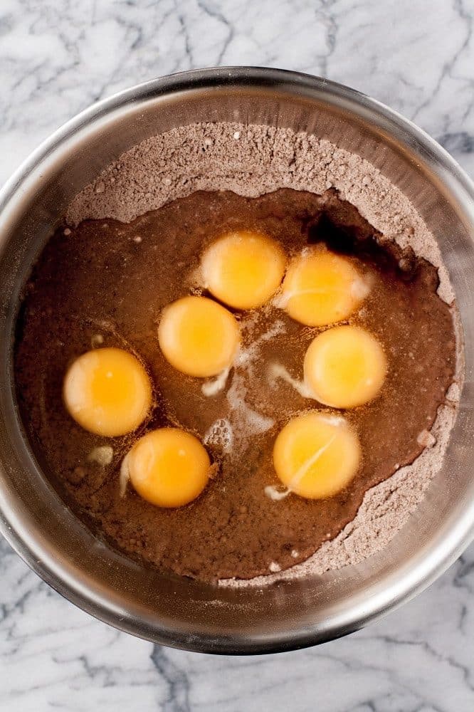 dry-ingredients-whisked-in-bowl-with-eggs-for-Low-Carb-Triple-Chocolate-Zucchini-Muffins