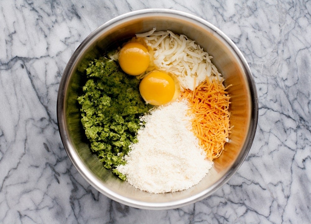 ingredients-in-stainless-steel-bowl-for-shredded-zucchini-in-bowl-for-Low-Carb-Zucchini-Pizza-Casserole