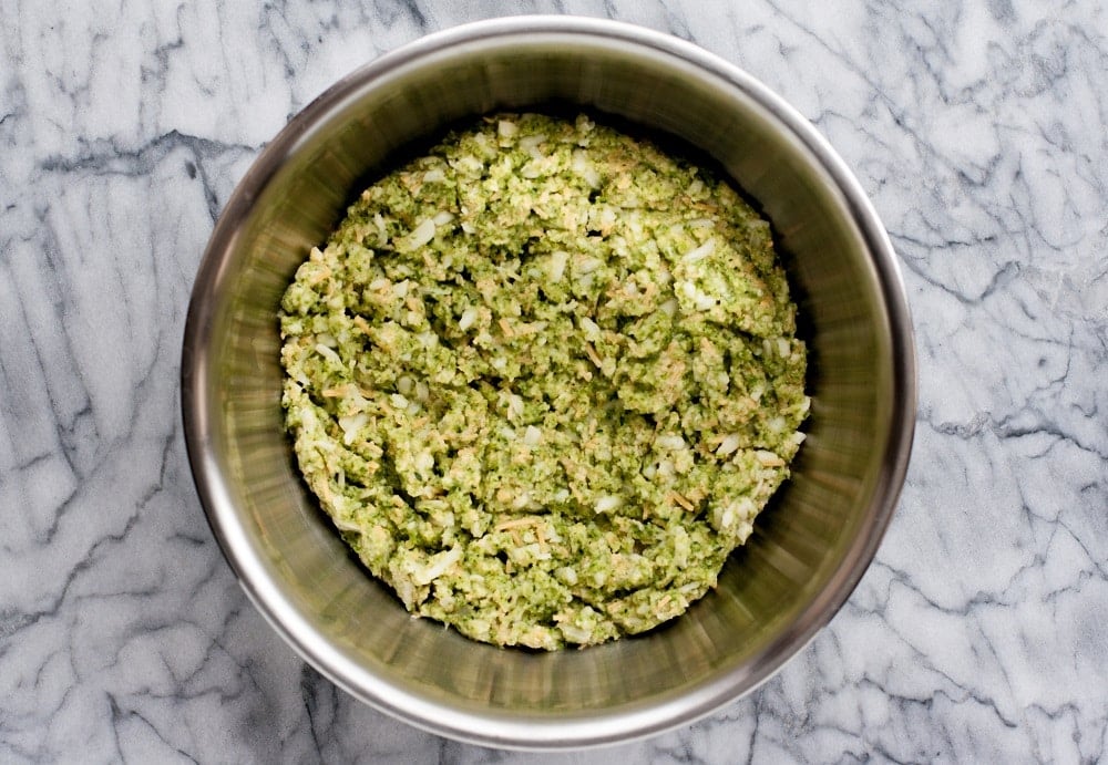 mixed-ingredients-in-stainless-steel-bowl-for-shredded-zucchini-in-bowl-for-Low-Carb-Zucchini-Pizza-Casserole