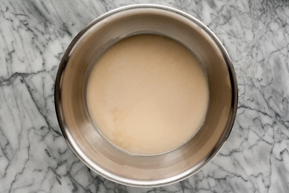 ingredients-for-Low-Carb-Coconut-Blondies-mixed-in-stainless-steel-mixing-bowl-on-marble-board