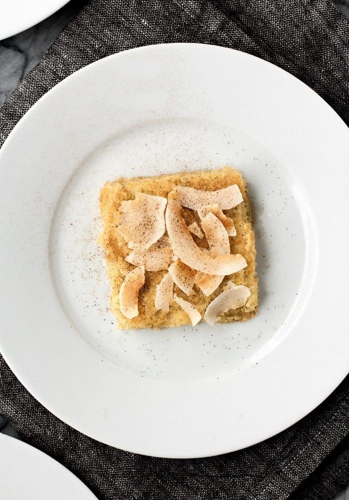 a low-carb coconut blondie on a small plate