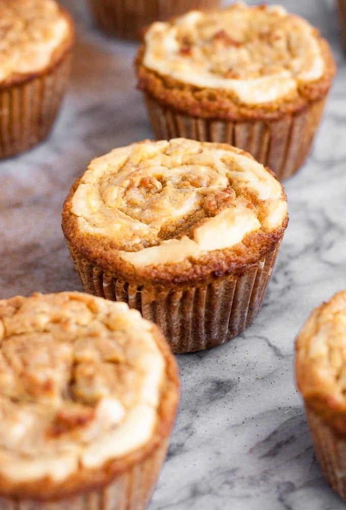 side-angle-shot-of-Cream-Cheese-Pumpkin-Muffins-on-marble-board