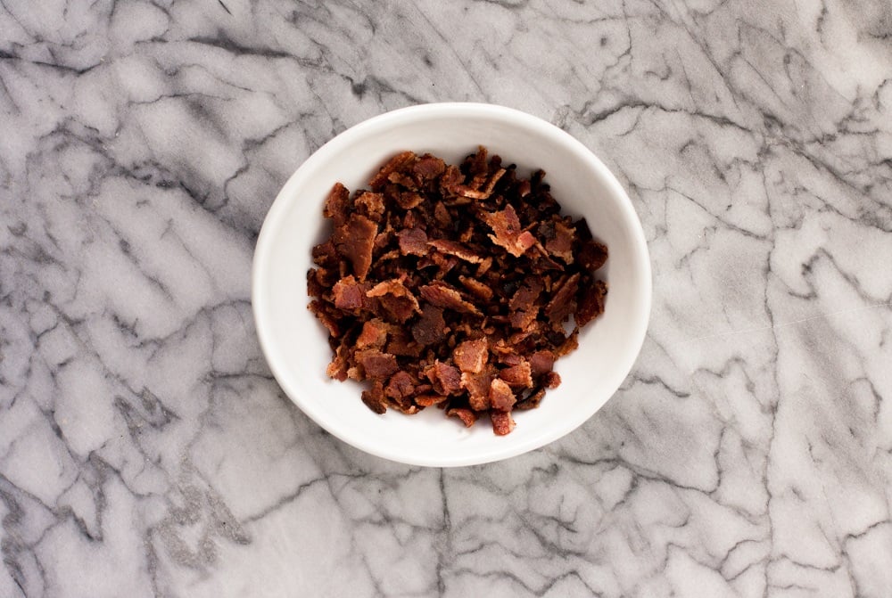 crumbled-bacon-on-marble-board-for-bacon-green-bean-casserole
