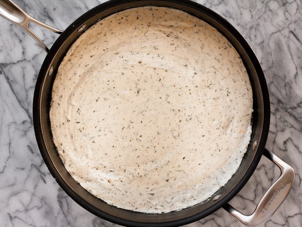 black-pot-with-cheese-sauce-on-marble-board-for-bacon-green-bean-casserole