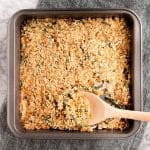 bacon-green-bean-casserole-in-baking-pan-on-marble-board-with-wooden-spoon