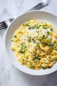 Keto Side Dish Recipes - parmesan garlic spaghetti squash eaten with a fork