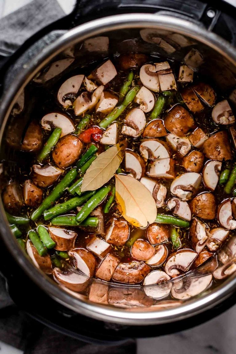 chopped mushrooms and green beans simmered in beef broth, pinot noir, diced tomatoes, red wine vinegar, and bay leaves in Instant Pot insert
