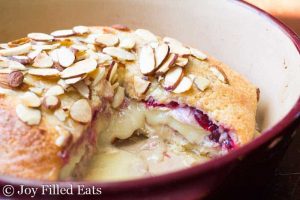 Cranberry Baked Brie with almond toppings in a bowl