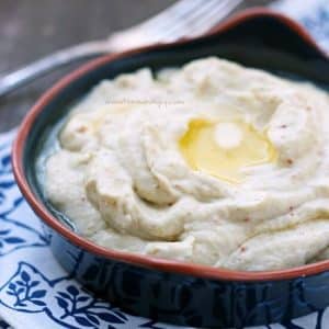 creamy bacon & smoked couda cauliflower mash with melted butter on top