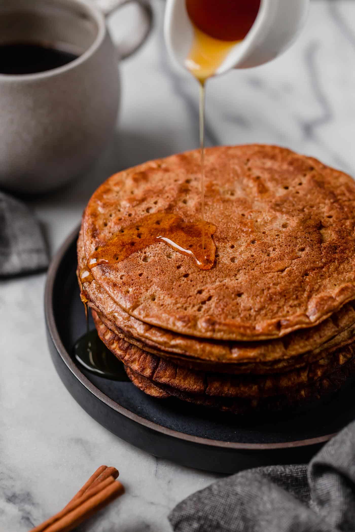 flourless pumpkin spice pancakes drizzled with lakanto maple-flavored syrup