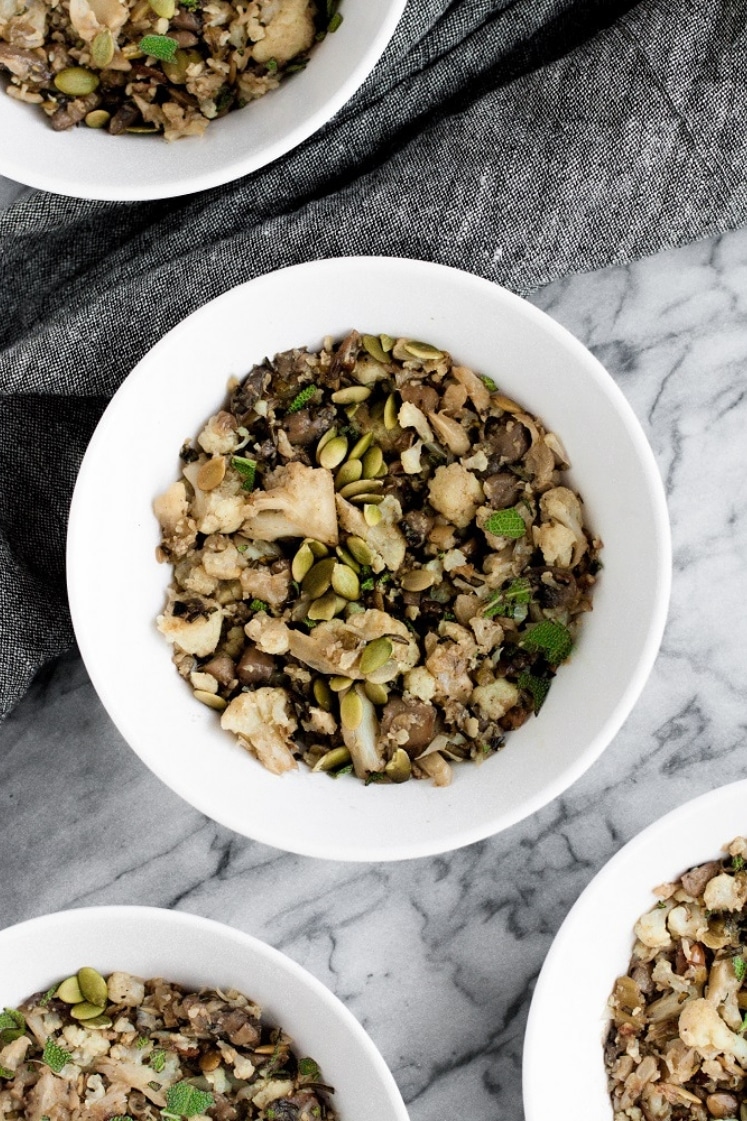 four bowls of low carb stuffing on top of a marble kitchen counter