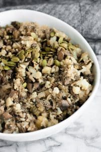 hero shot of a bowl of sautéed low carb stuffing on top of a marble kitchen counter