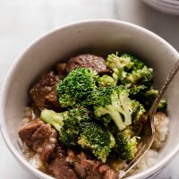 instant pot beef broccoli in a bowl on top of a marble counter