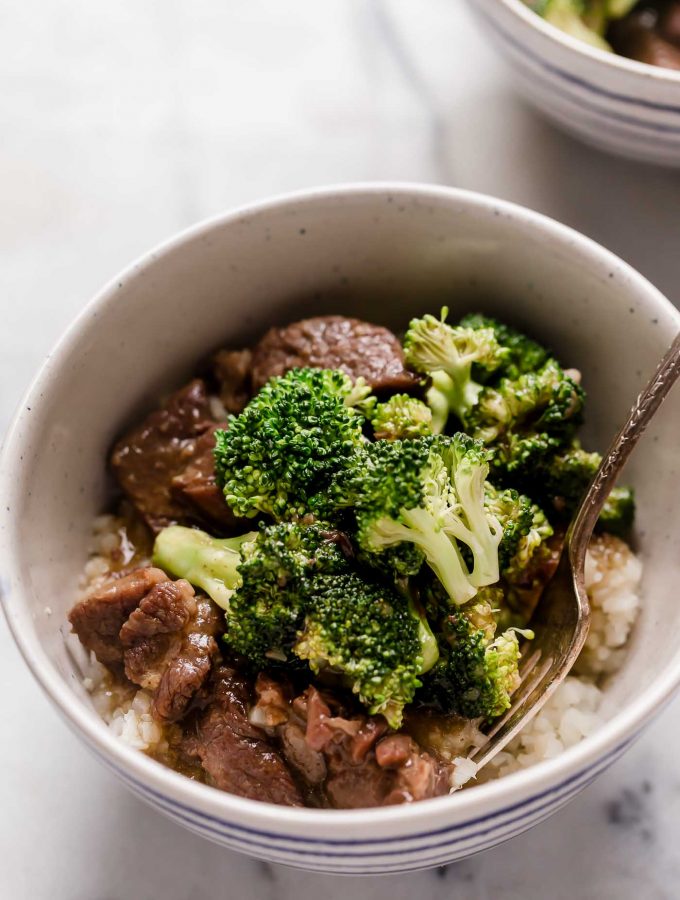 instant pot beef broccoli in a bowl on top of a marble counter