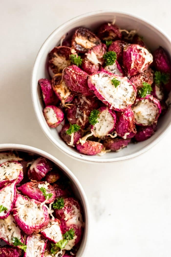 close-up shot of two bowls of keto roasted radishes