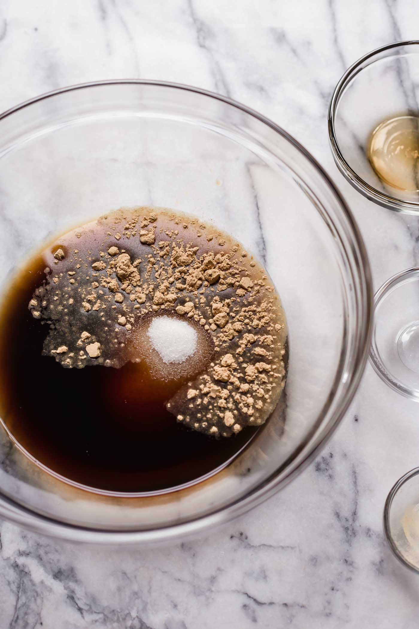 mix in liquid aminos, ground ginger and monk fruit sweetener into the beef broth