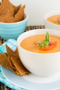 Bowl of Vegan Cream of Tomato Soup with low-carb crackers