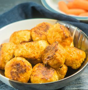 bowl of spicy baked cauliflower cheese bites