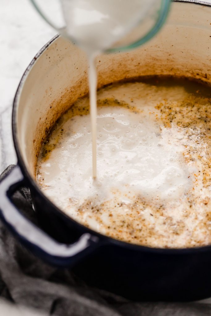 butter, garlic, spices, chicken broth, heavy cream, and parmesan in a large pot