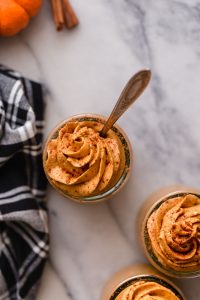 servings of low-carb pumpkin mousse on top of a marble kitchen counter