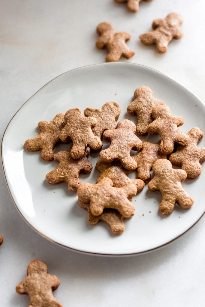 close up shot of 13 pieces of keto gingerbread cookies on a saucer