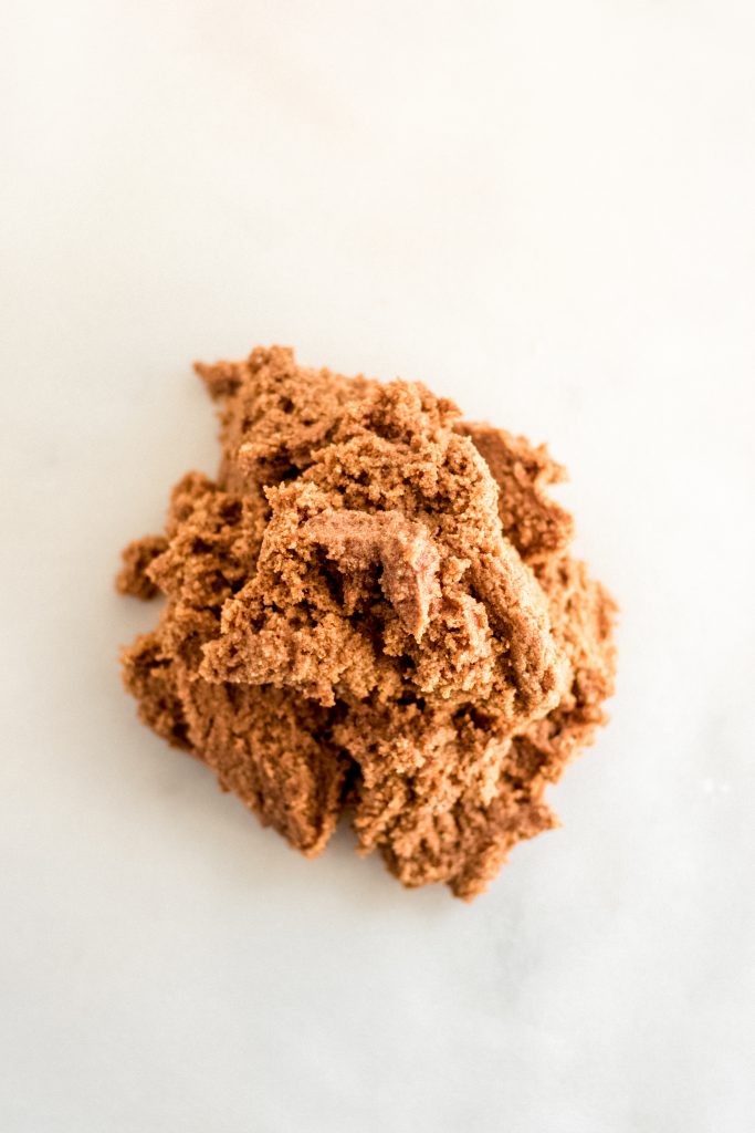 chilled keto gingerbread cookie dough on top of a marble kitchen counter