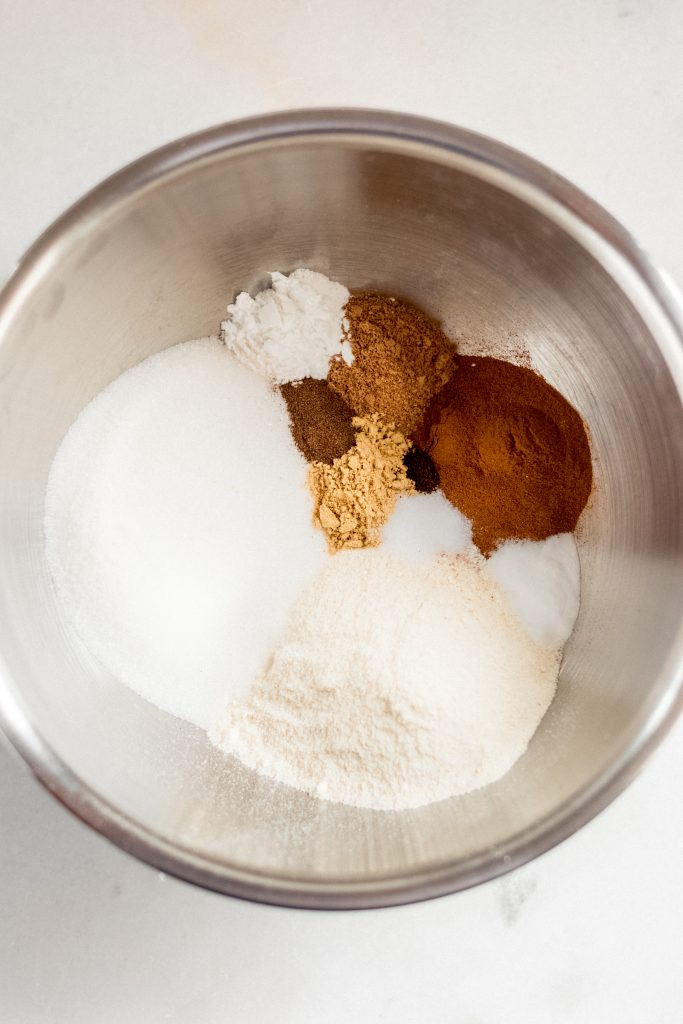dry ingredients for keto gingerbread cookies in a large stainless steel mixing bowl