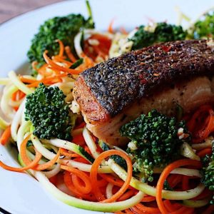 crispy salmon filet over spiralized vegetables