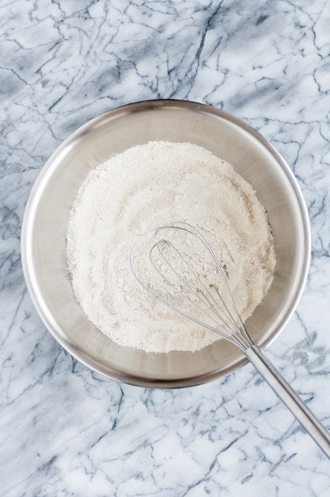 coconut flour, monk fruit sweetener, cream of tartar, baking soda, espresso powder, salt, and xanthan gum whisked together in a stainless steel mixing bowl
