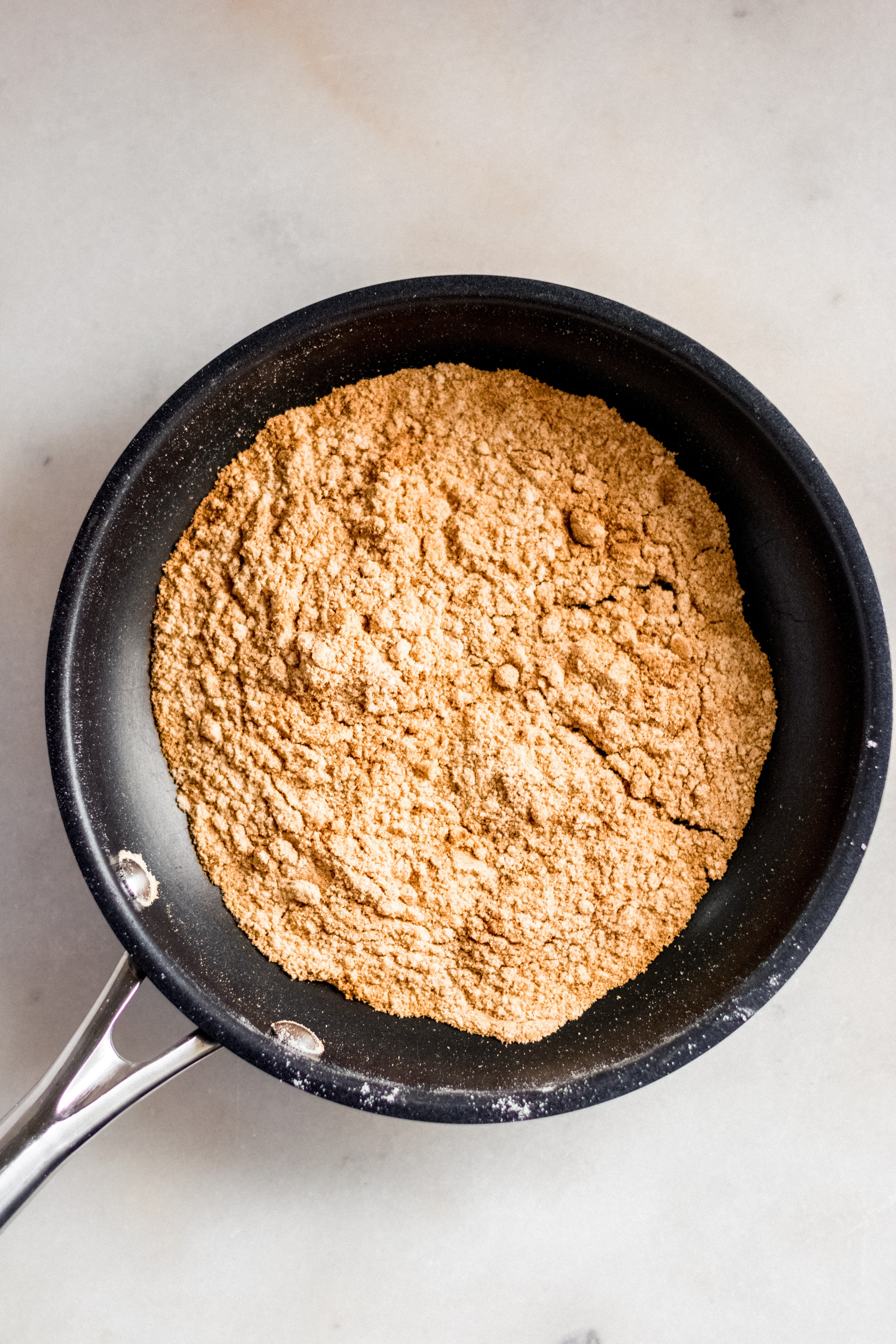 Coconut flour on a heated pan image