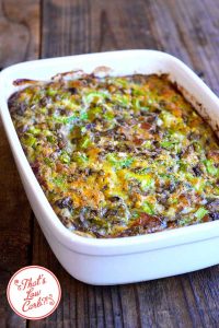 Dish of breakfast casserole on a wooden surface