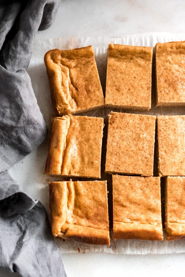 close up shot of baked pumpkin cheesecake bars