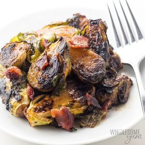 Crispy Pan Fried Brussels Spoutrs on a plate with a fork