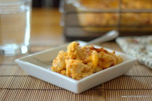 Square plate with 1 serving of BBQ chicken casserole