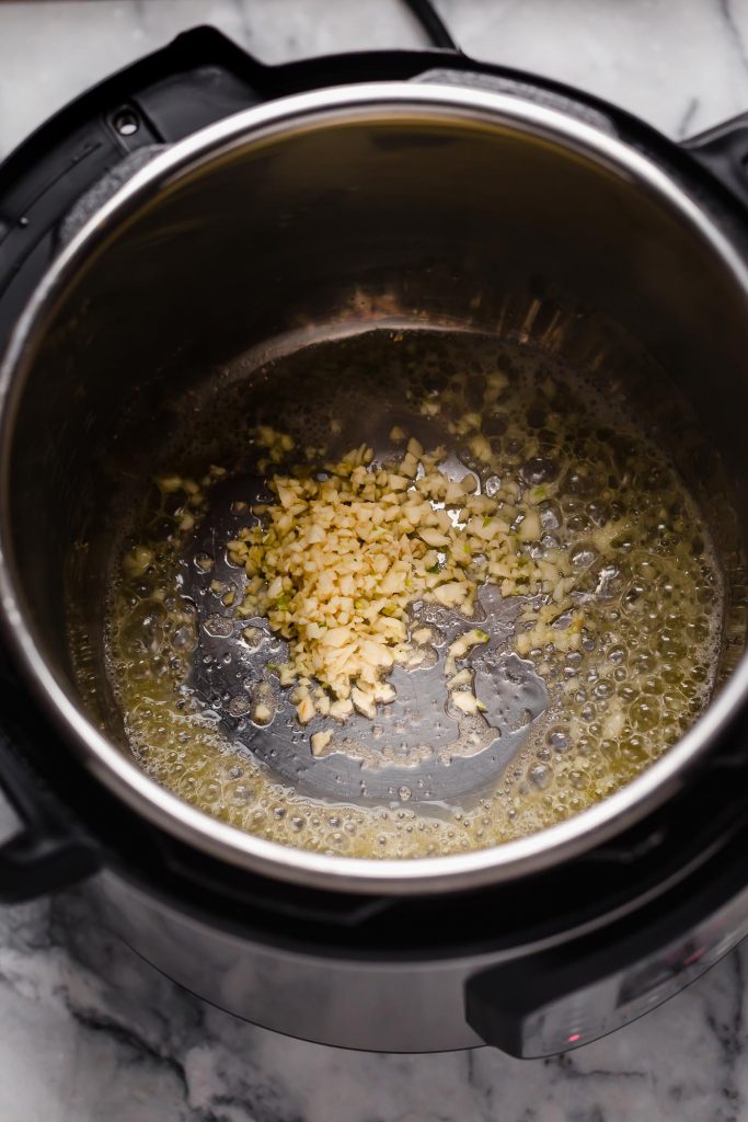 instant pot with sauteed garlic in butter