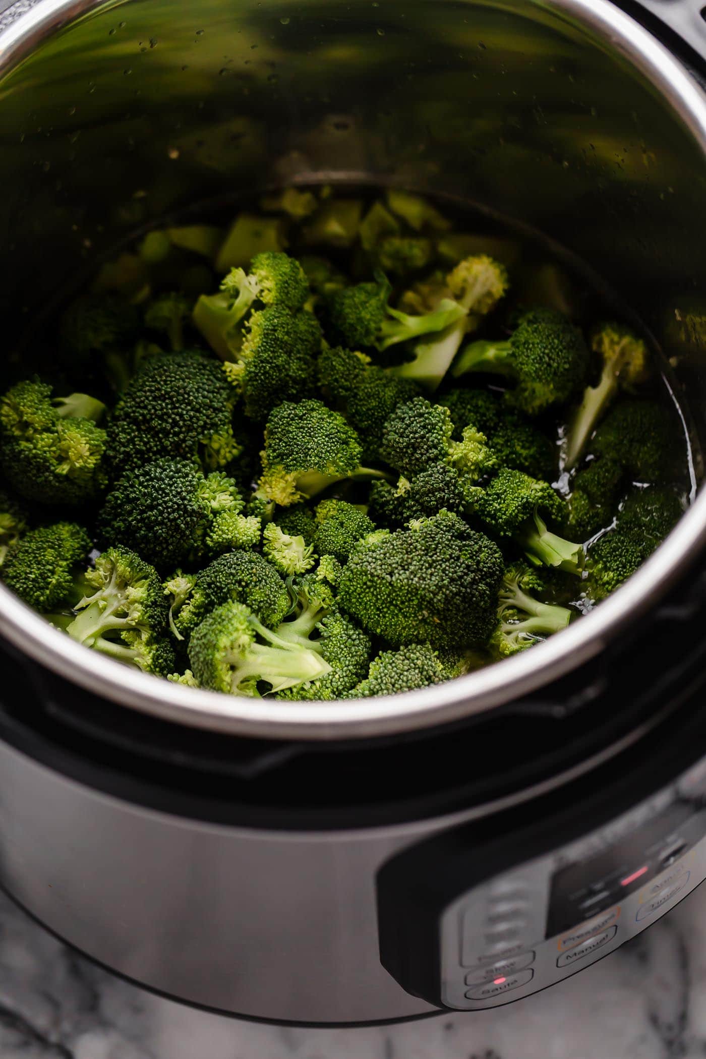 broth garlic butter soup with fresh broccoli florets