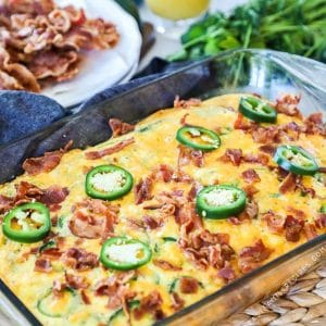 glass dish with jalapeño popper breakfast casserole and ingredients in the background