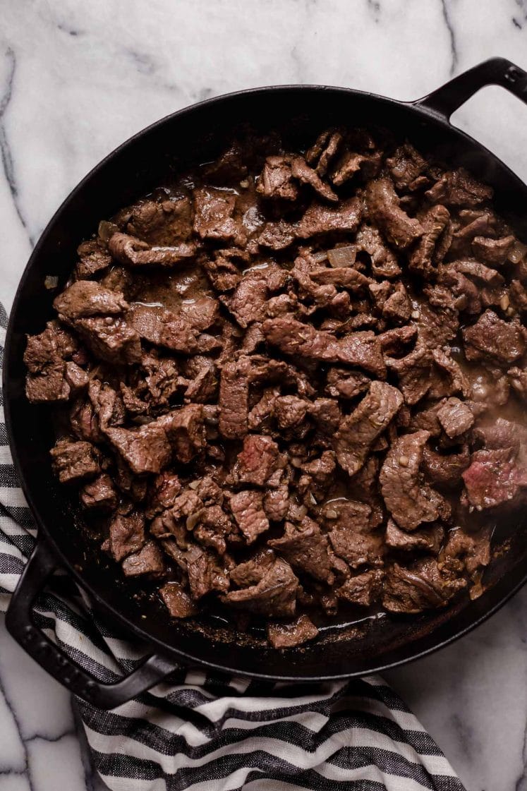 chopped beef thyme salt and pepper and sauteed until beef is cooked on a large cast iron sauce pan