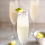 hero shot 3 servings of champagne margaritas in a champagne glass with salt and a lime wedge