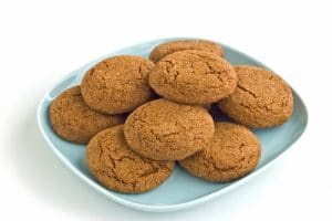 pile of keto gingersnaps on a light blue plate
