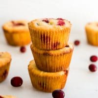 a stack of 3 keto cranberry orange muffins